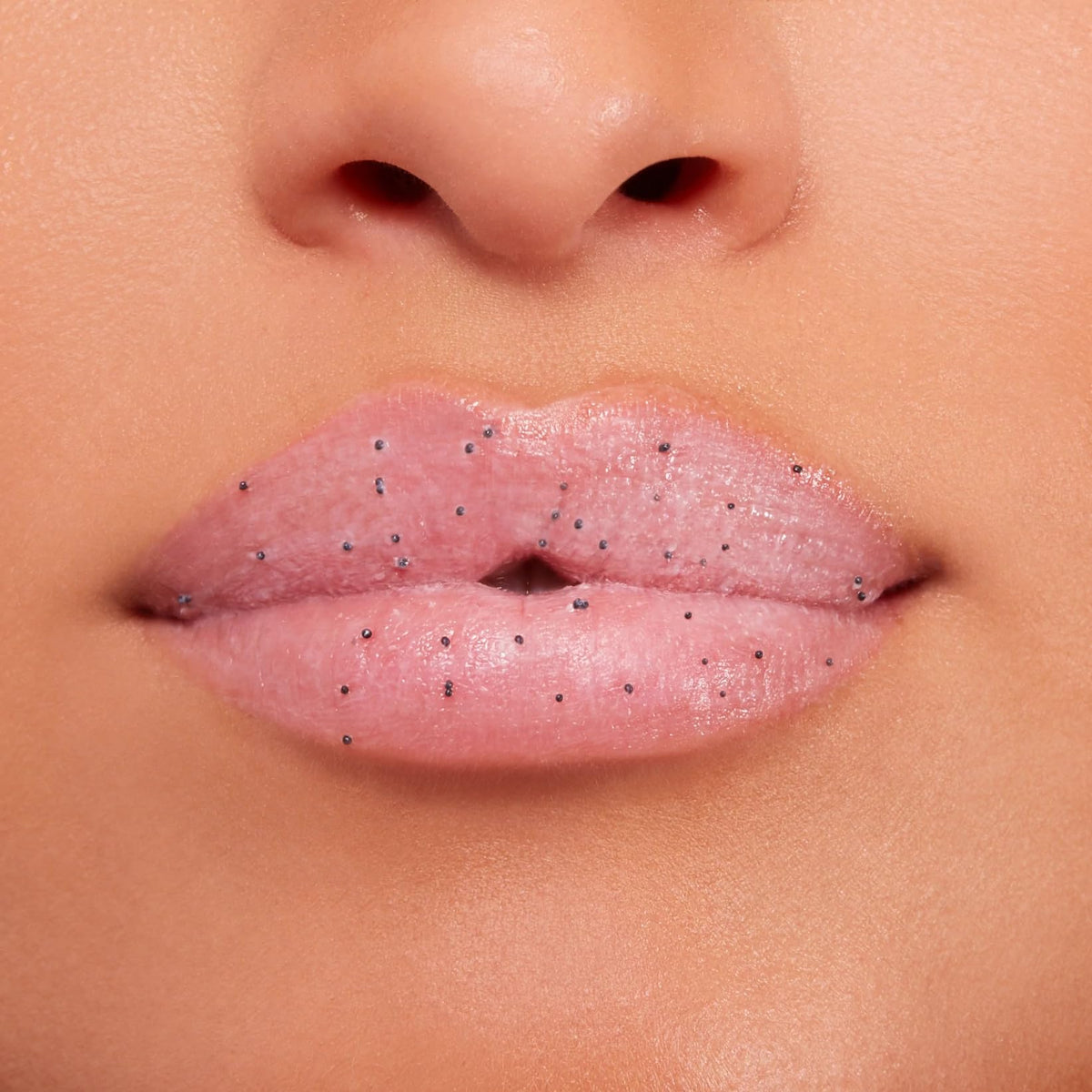 BUXOM Power-Full Lip Scrub sugar-texture macro for gentle dry-skin buffing.