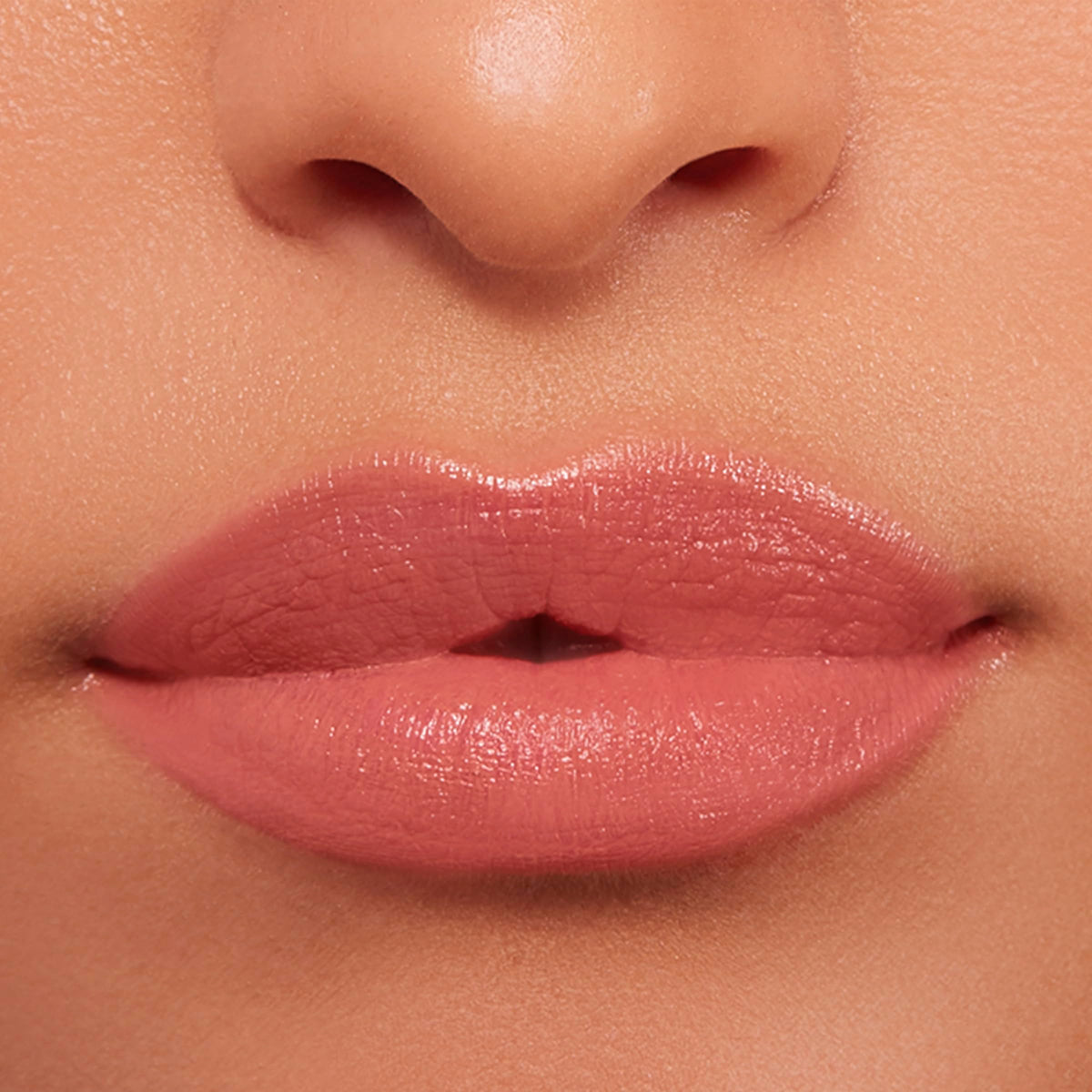 BUXOM Power-Full Lip Balm Inner Glow creamy texture on fingertip.