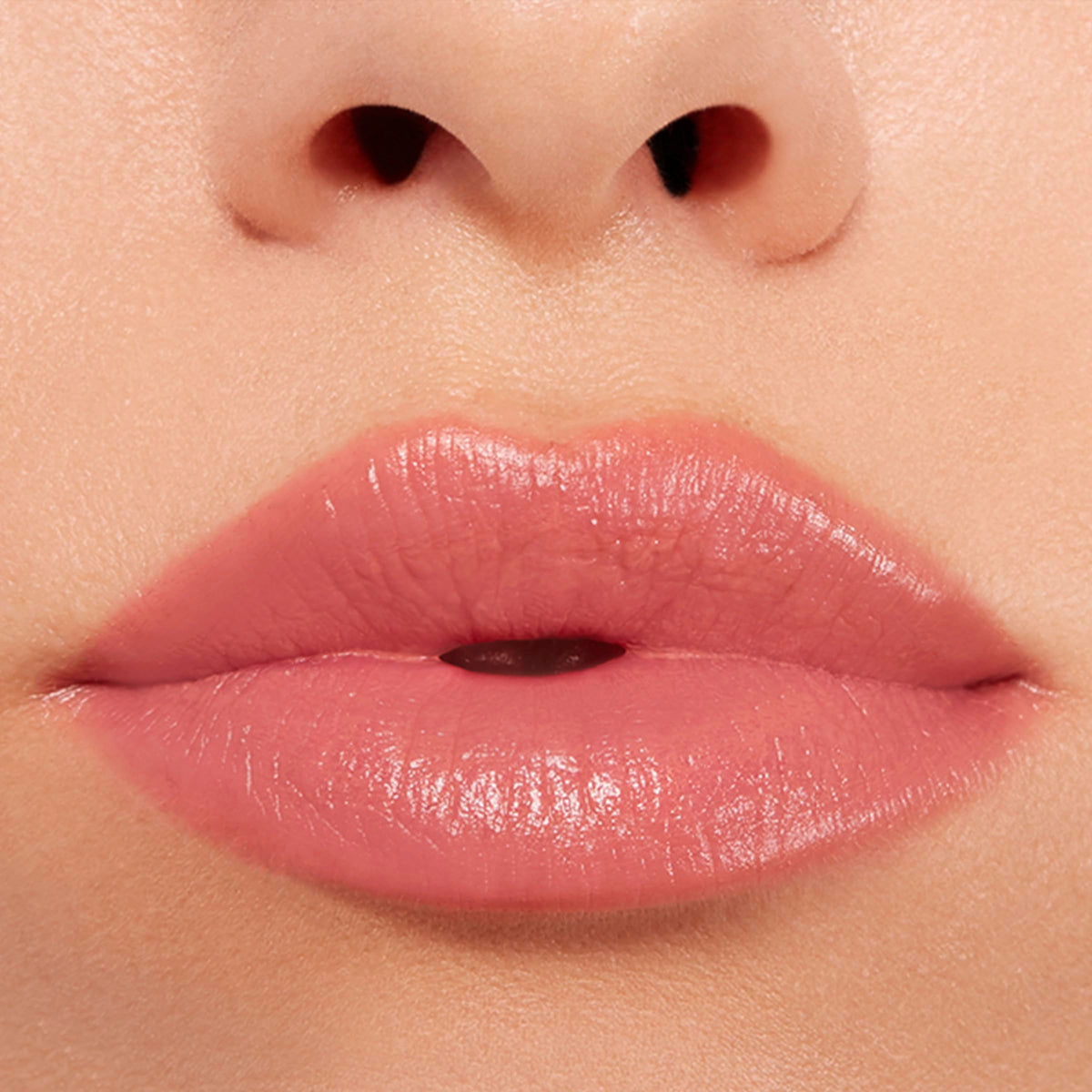 BUXOM Power-Full Lip Balm Inner Glow translucent tint on lips for natural look.