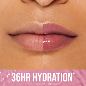 Applicator brush applying Buxom lip tint for smooth color.