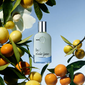 By Rosie Jane Remi label close-up highlighting vegan, toxin-free formula.