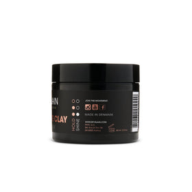By Vilain Dynamite Clay damp-hair styling for flexible shaping.