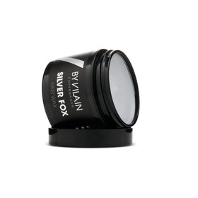 By Vilain Silver Fox Mud Wax comes in a sleek 2.2oz jar for travel-ready grooming.