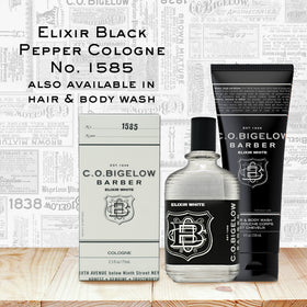 C.O. Bigelow Elixir White glass bottle on a vanity display.