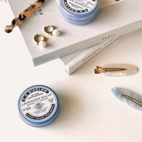 Desk-ready Lavender Salve Tins in a bag for quick touch-ups.