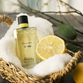 Drops on skin suggest a living scent with subtle warmth