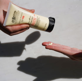C.O. Bigelow Lemon Hand Treatment ingredients scene featuring lemon extract and vitamin C for hydration.