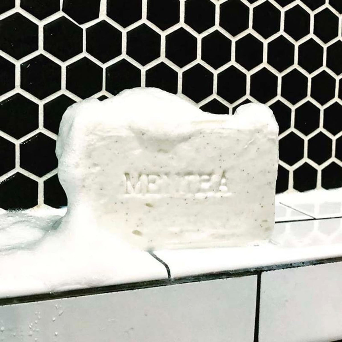 C.O. Bigelow Mentha Exfoliating Bar Soap walnut powder close-up demonstrates exfoliation.