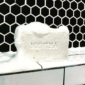 C.O. Bigelow Mentha Exfoliating Bar Soap walnut powder close-up demonstrates exfoliation.