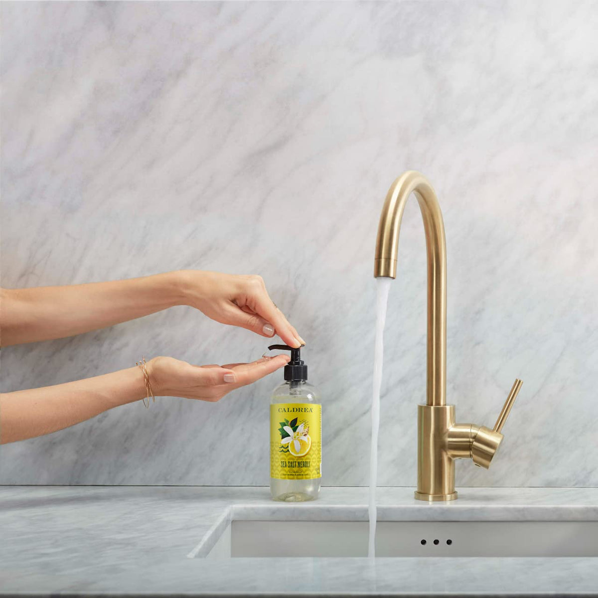 Caldrea Sea Salt Neroli hand wash foam closeup highlighting rich lather.