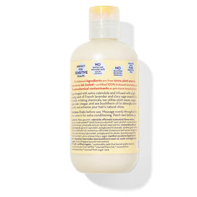 Close-up of California Baby Calendula Hair Conditioner label emphasizing vegan, allergen-free formula.