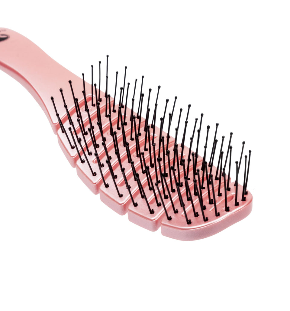 Calista Smoothie Brush pink angled view shows gentle detangling on hair