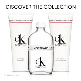 Calvin Klein CK Everyone base notes scene shows cedarwood, patchouli, amber warmth.