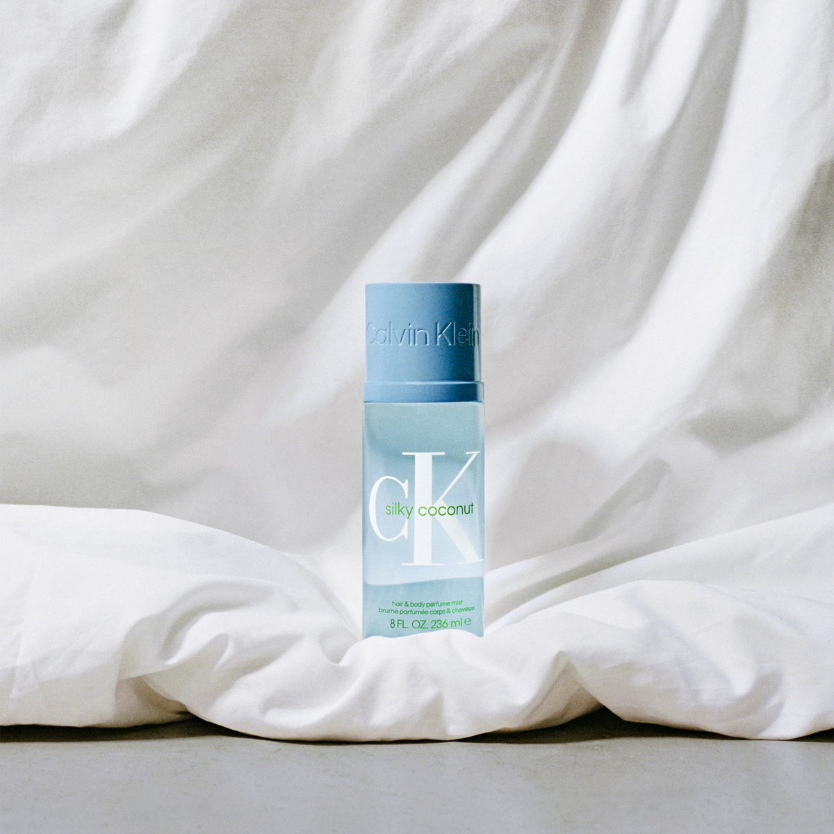 Calvin Klein CK Silky Coconut embossed cap suggests premium finish.
