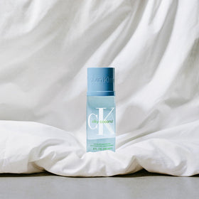 Calvin Klein CK Silky Coconut embossed cap suggests premium finish.