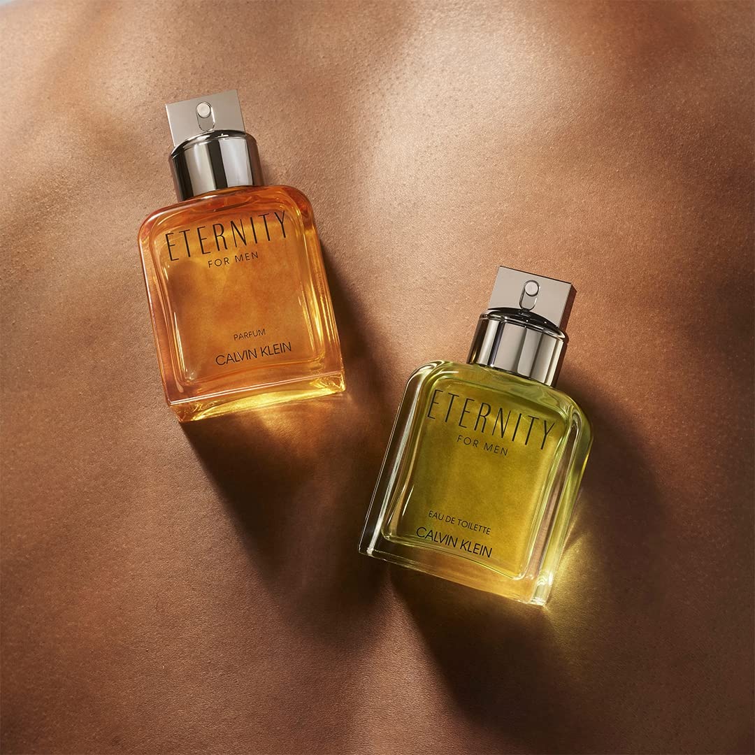 Calvin Klein Eternity For Men Parfum bottle with amber glow, hints lasting presence