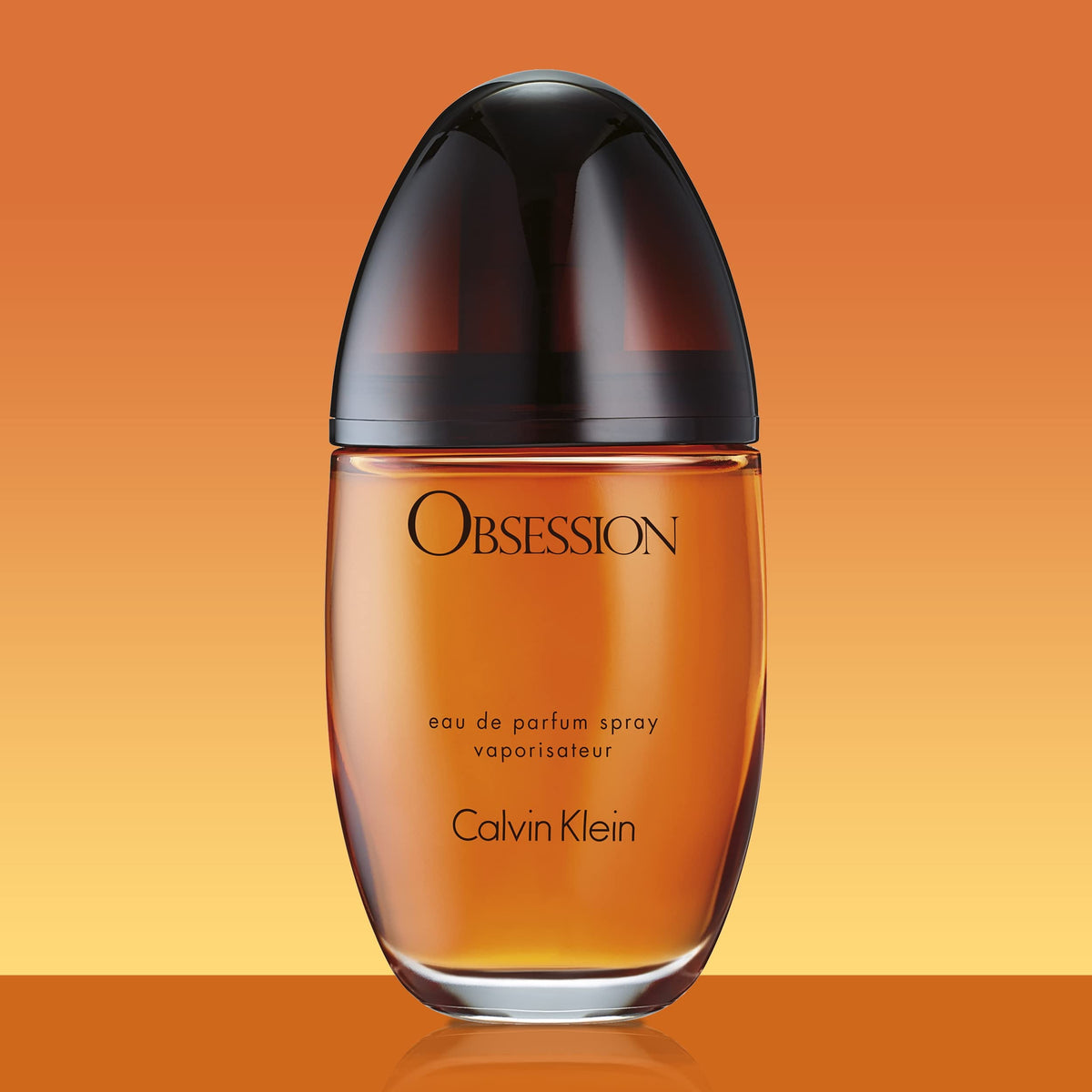 Obsession for Women bottle on desk evokes evening elegance.