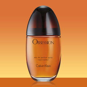 Obsession for Women bottle on desk evokes evening elegance.