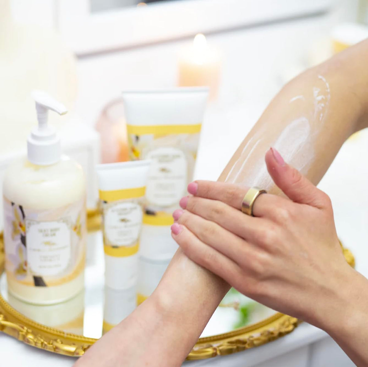Hands applying Camille Beckman French Vanilla moisturizer for hydrated skin