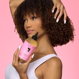 Scalp moisture-focused shot featuring Camille Rose Cleansing Rinse for refreshed hair