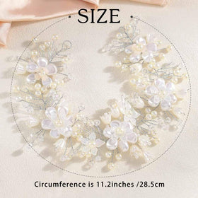 Campsis white floral hairpiece catching light for aisle moments