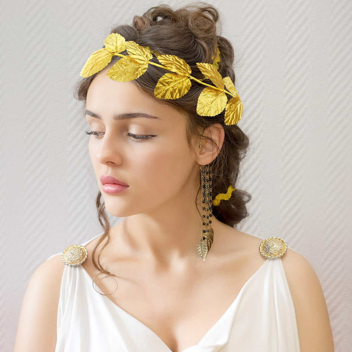 Canlierr gold leaf crown detail enhances theater performances.