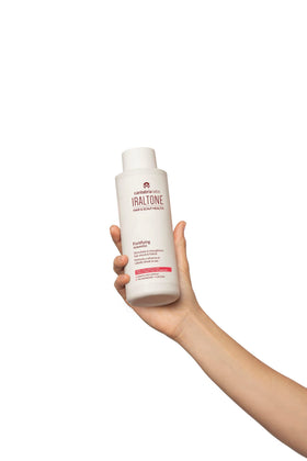 Cantabria Labs IRALTONE fortifying shampoo hair close-up shows shiny, hydrated strands.