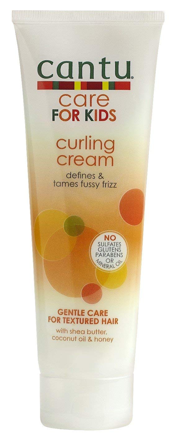 Cantu Care for Kids Curling Cream being applied to damp curls for definition.