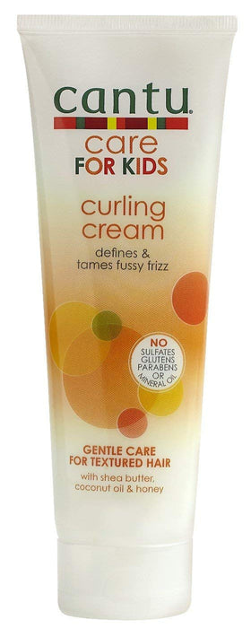 Cantu Care for Kids Curling Cream being applied to damp curls for definition.