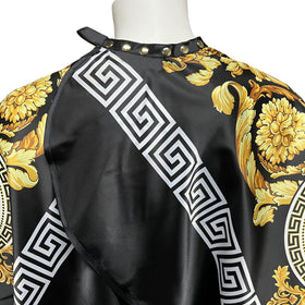 CapeshionPro cape shows adjustable neck snaps for secure fitting.