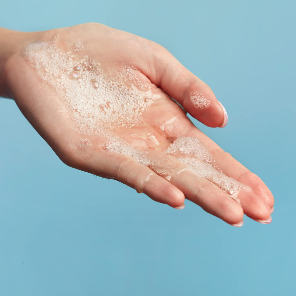 Rinse action of Capri Blue Volcano bar soap delivering a refreshing cleanse.