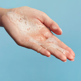 Rinse action of Capri Blue Volcano bar soap delivering a refreshing cleanse.