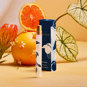 Capri Blue Volcano Flora Edit spray pen held in hand for portable scent