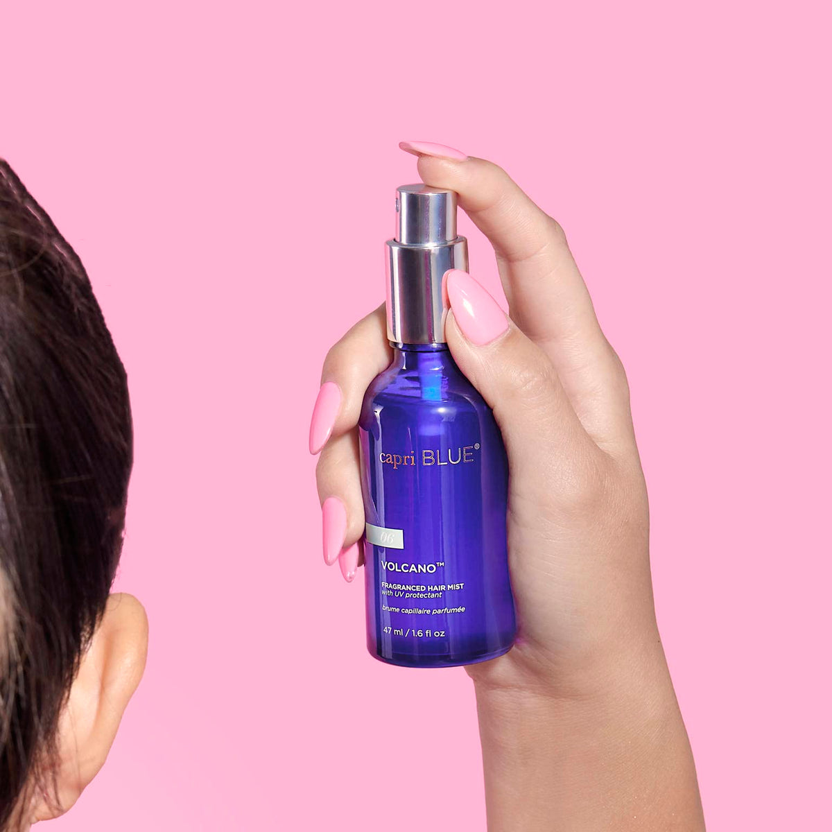 Capri Blue Volcano hair mist being spritzed for a fresh finish