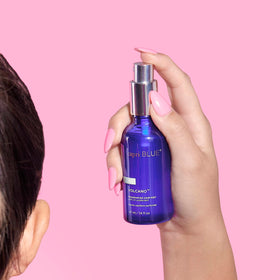 Capri Blue Volcano hair mist being spritzed for a fresh finish