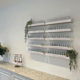 Care&More YJ display for sunglasses and makeup items beside polishes.