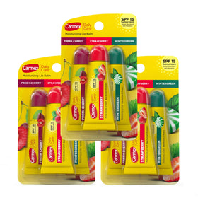 Carmex Daily Care Wintergreen lip balm tube in use protecting lips outdoors