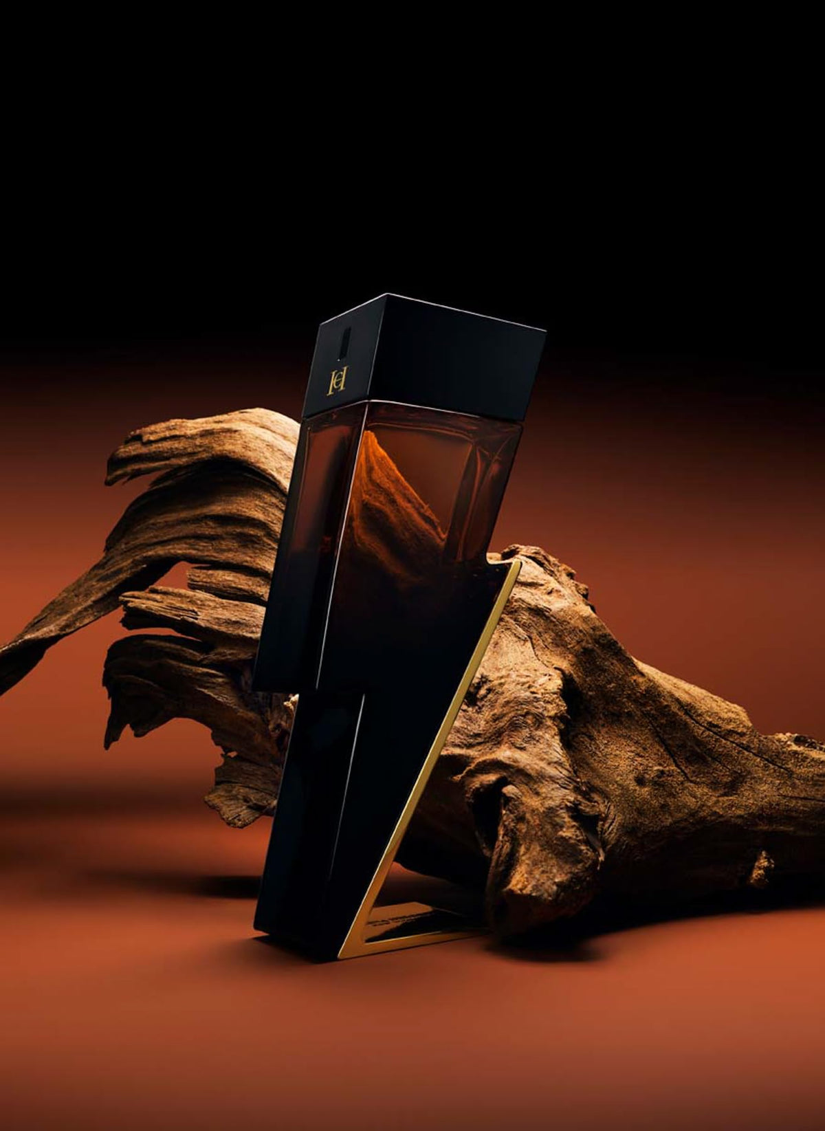 Carolina Herrera Bad Boy Elixir spray action demonstrating long-lasting projection.