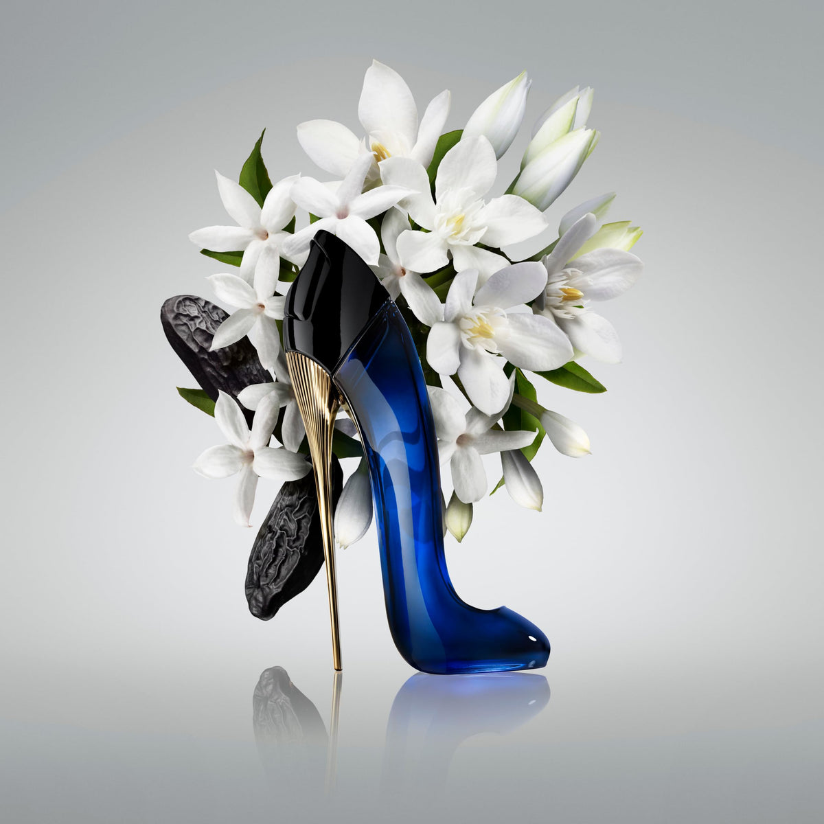 Carolina Herrera Good Girl bottle close-up, showcasing elegant curves and cap.