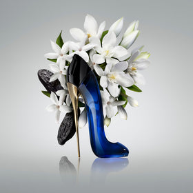 Carolina Herrera Good Girl bottle close-up, showcasing elegant curves and cap.