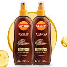 Carroten Intensive Tanning Oil Spray bottle for smooth, bronze-ready skin.