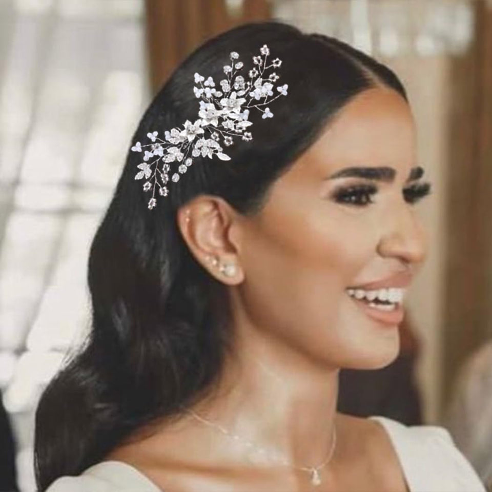 Catery rhinestone hair comb in silver flower, side view for bridal styling.