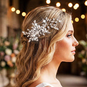 Catery wedding hair piece for the bride in silver complements an elegant style