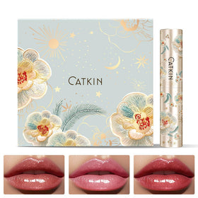 Swatches of Catkin glossy lip balm gift set showing rosy tint