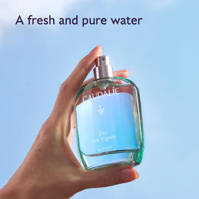 Caudalie Eau des Vignes Fresh Fragrance applied on skin for light daily radiance.