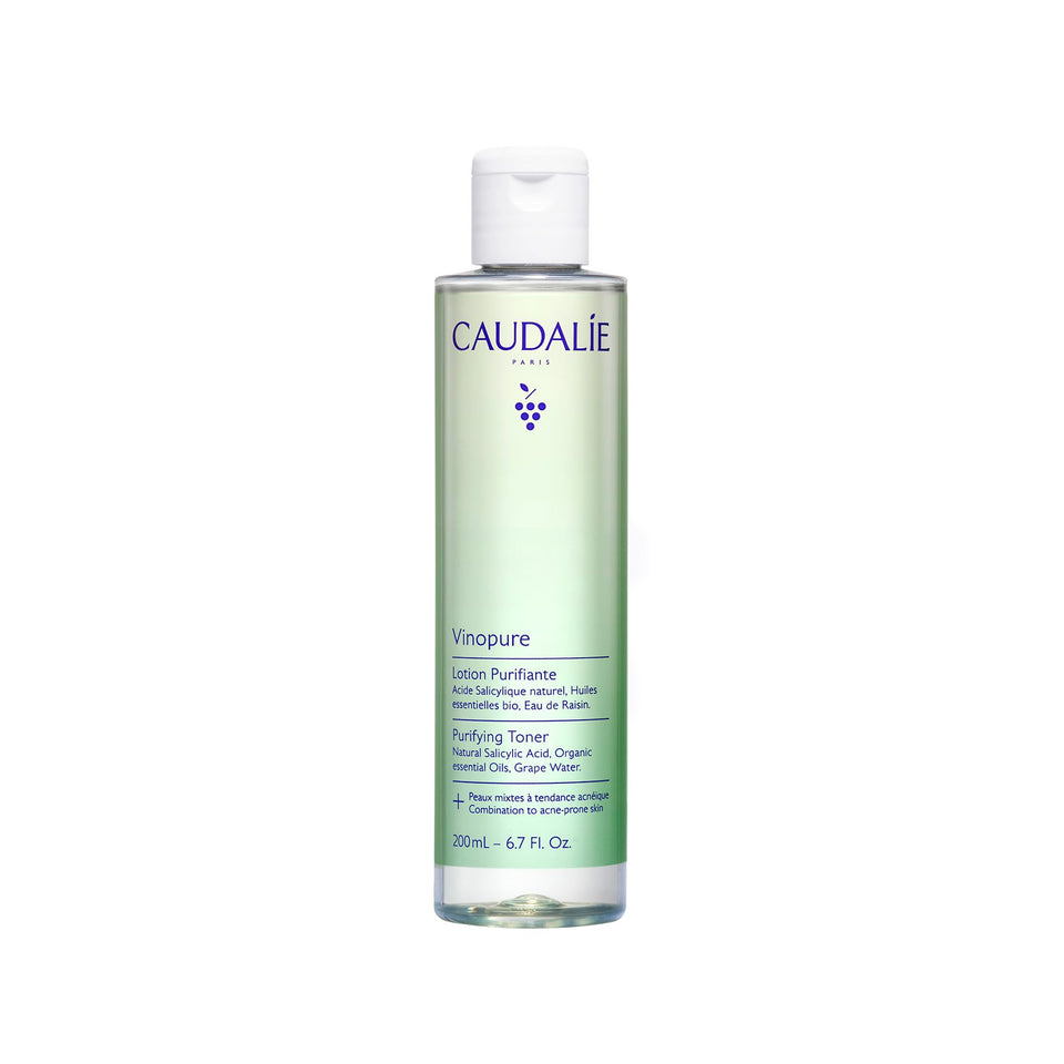 Caudalie Vinopure toner bottle close-up showing purifying action on pores.