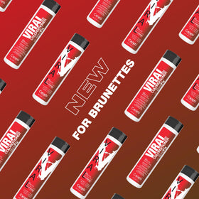 Celeb Luxury Viral Red Conditioner color swirl on hair for vibrant tone.