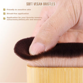 CeleCily kabuki brush blends tan on body and face.