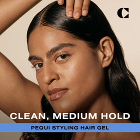 Applying Ceremonia Pequi Styling Gel for frizz control on hair