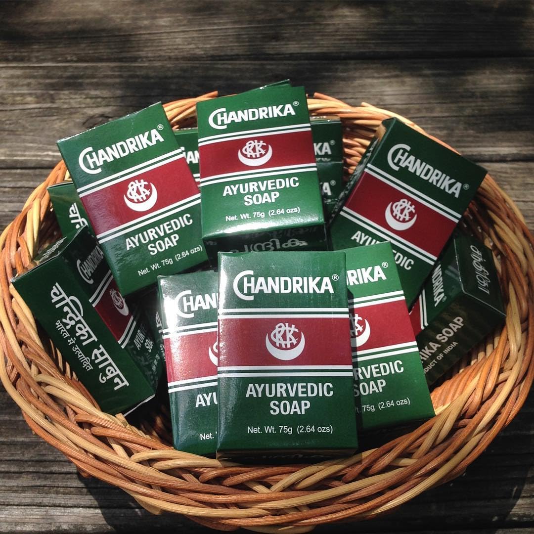 Chandrika bar closeup texture reveals smooth, herbal formula for soft, refreshed skin.